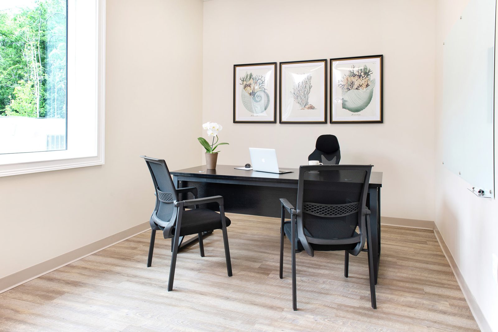 Corner private office with large exterior windows and natural light